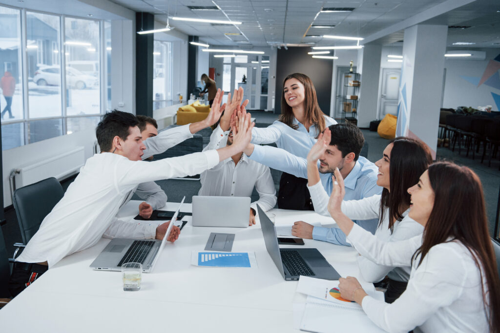 cheerful-business-people-job-is-done-group-office-workers-happy-hit-their-own-records-being-successful