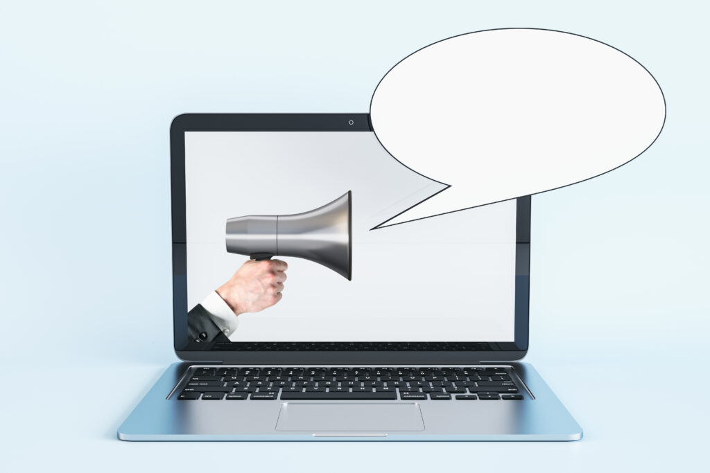 laptop-computer-with-megaphone-speech-bubble-white-background-business-email-marketing-mock-up-place-concept