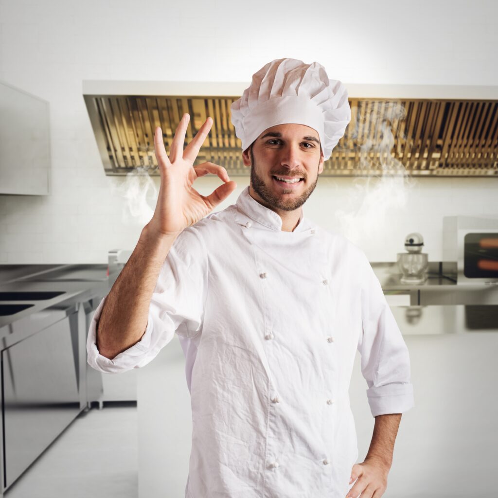 portrait-smiling-man-standing-kitchen