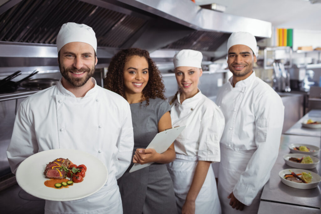 restaurant-manager-with-his-kitchen-staff